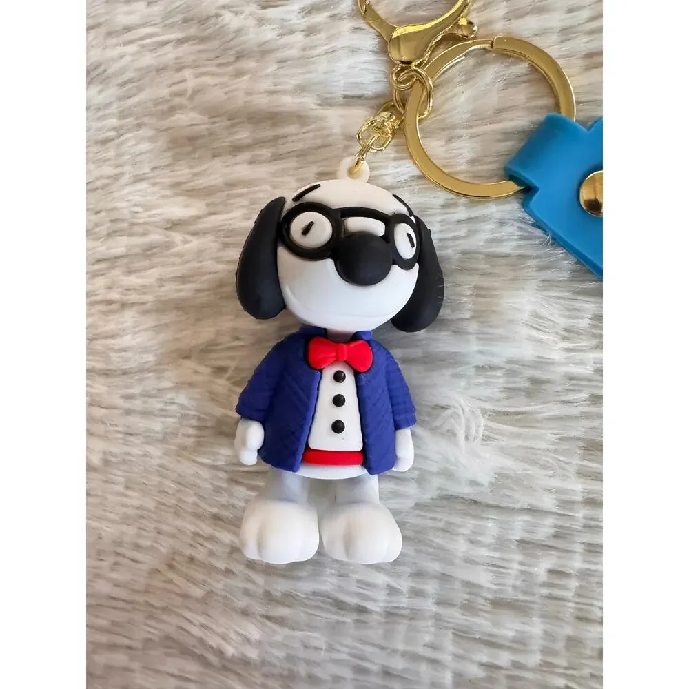 Snoopy suit and red bow tie keychain blue strap and white Snoopy face graphic